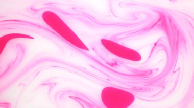 Sudaki pembe ve beyaz mürekkep lekeleri. Soyut arka plan görüntüleri.