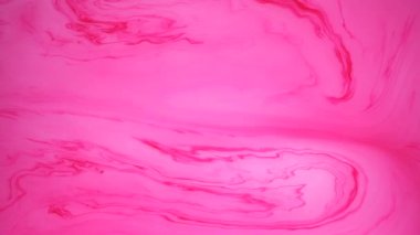 Sudaki pembe ve beyaz mürekkep lekeleri. Soyut arka plan görüntüleri.