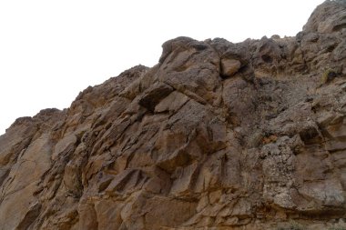 Kayalık dağ yamacı ya da üst ön plan beyaz arka planda izole edilmiş yakın plan. Matet boyama için element, alanı kopyala.