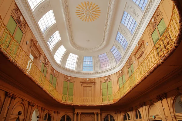 HAARLEM, NETHERLANDS - MARCH 24, 2019: The Oval room (dated from 1784) inside Teylers Museum (art, natural history and science) with wooden and ornate architecture