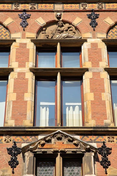 Close-up on the external facade of the old Ministry of Justice (built between 1876 and 1883), located on Plein Square, with details of the carvings, The Hague, Netherlands