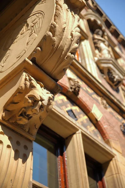 Close-up on the external facade of the old Ministry of Justice (built between 1876 and 1883), located on Plein Square, with details of the carvings, The Hague, Netherlands