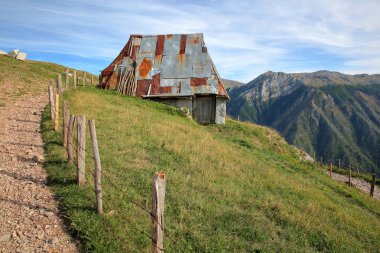 A traditional house in Lukomir village, overlooking Rakitnica canyon. Lukomir is Bosnia's highest village at 1469 meters and the most remote in the entire country, Bosnia and Herzegovina clipart