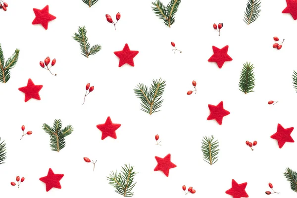 Christmas pattern with stars, berries and coniferous twigs.