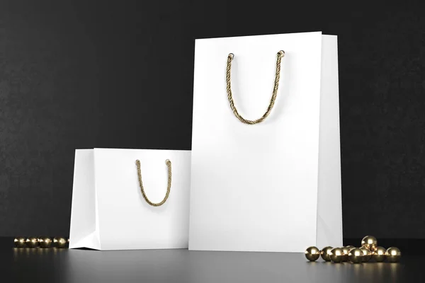 Bolsas de compras blancas premium maqueta, paquete para compras en un fondo negro. Bolsa de compras de papel blanco con asas doradas se burlan. Bolsas de papel de lujo, 3d renderizado . —  Fotos de Stock