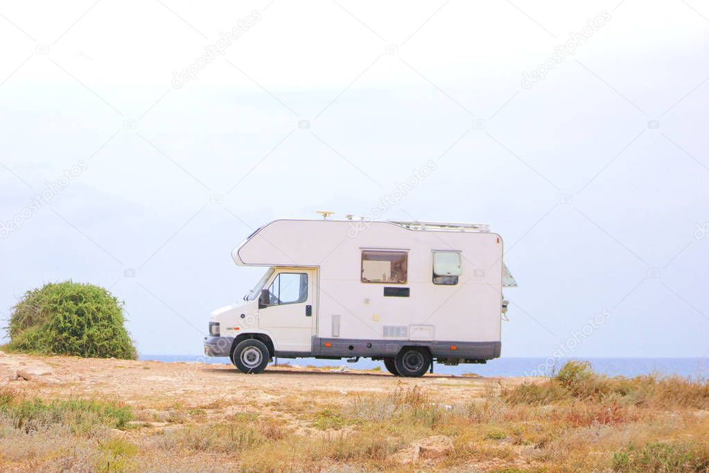 House on the wheels / Camper van on the seaside, travel in vacation