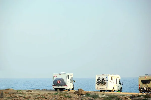 House on the wheels / Camper van on the seaside, travel in vacation