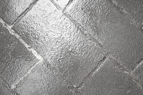 Eski tuğla köprü döşeli. Eski gri arka plan. Arka plan taşların.