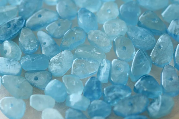 Aquamarine is blue. Natural stone is blue aquamarine. The backgr