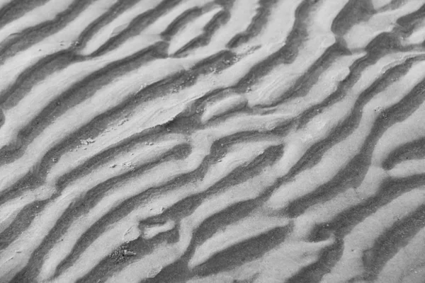 Fundo cinzento. Fundo de areia. Belas ondas e areia du — Fotografia de Stock