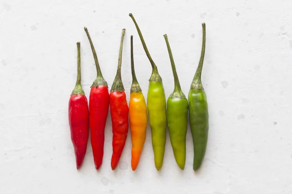 Red Hot Chili Peppers On Background or White Table. A Lot of Red