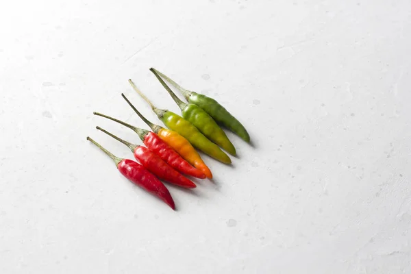 Red Hot Chili Peppers On Background or White Table. A Lot of Red — Stock Photo, Image