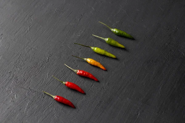 Red Hot Chili Peppers On Background or Black Table. A Lot of Red