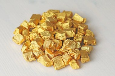 Ingots or Nuggets of Pure Gold. Gold leaf. Tea Resin Puer clipart