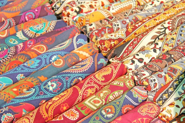 Bright colored fabrics India ornaments and oriental drawings. It