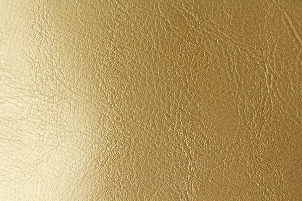 Gold or Bronze Natural Leather Background. Shiny yellow leaf gol