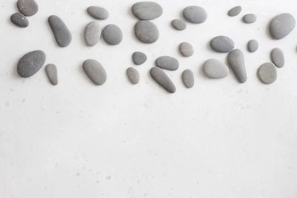 Wellness-Hintergrund mit grauen Steinen, grauer moderner Hintergrund, Deckel, — Stockfoto