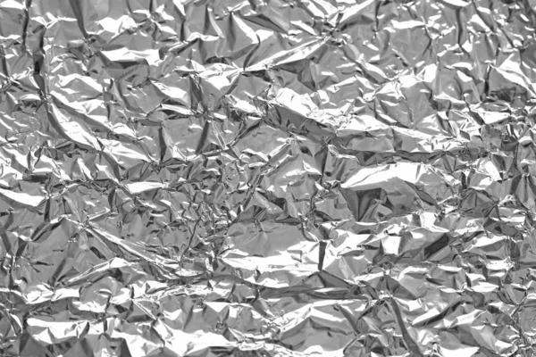 Foil. Metal crumpled background. Gray or silver background