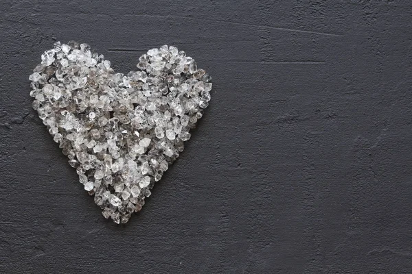Heart of stones, love. Scattered diamonds on black background. R