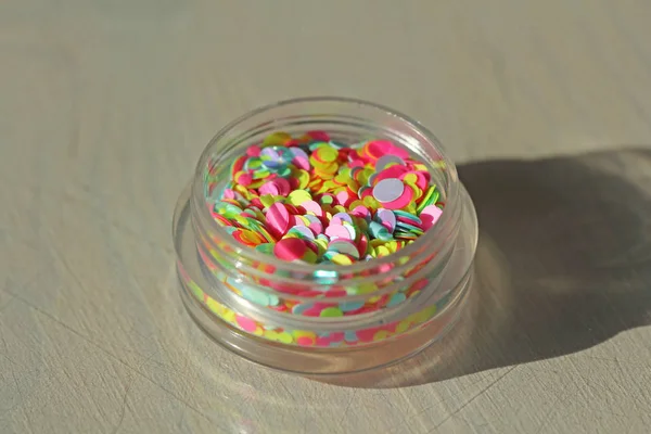 Multi colored Sequins for the design of nails in a Jar. Glitter — Stock Photo, Image