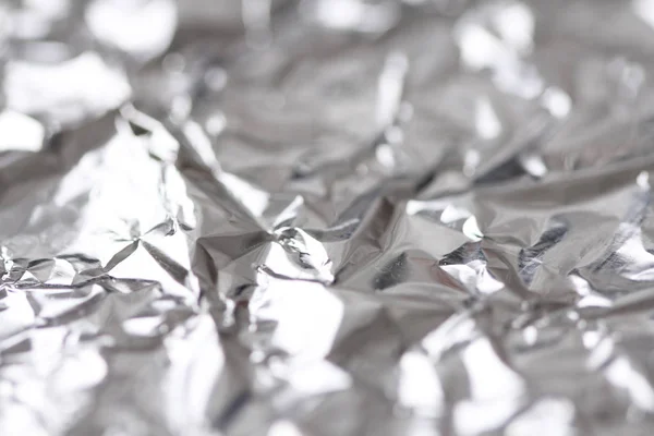Foil. Metal crumpled background. Gray or silver background