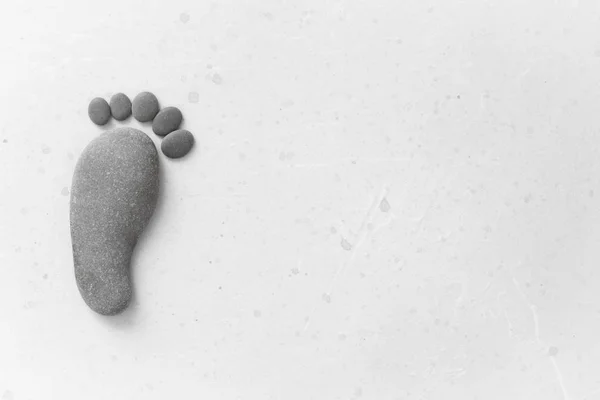 Footprints made of stones. Happy feet. Stone arranged like footp — Stock Photo, Image