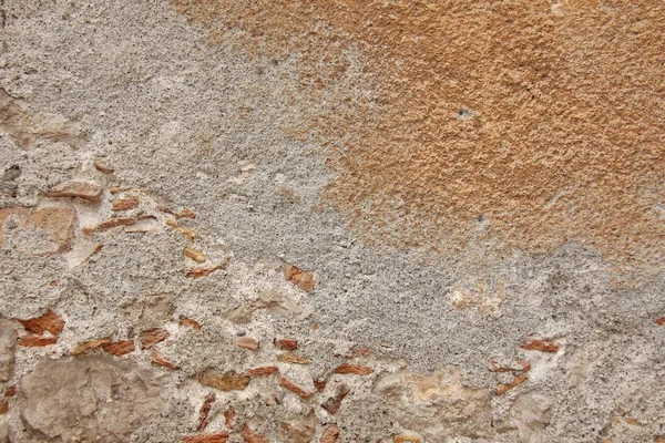 Hintergrund aus braunen, beigen und grauen Steinen. die alte mauer von ston — Stockfoto