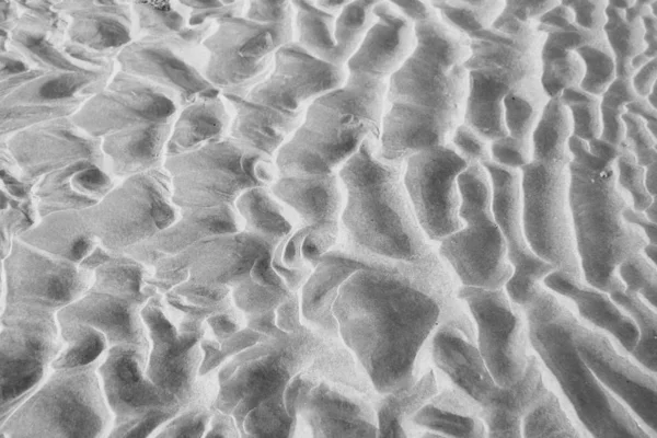 Fondo gris. Fondo de arena. Hermosas olas y arena du — Foto de Stock