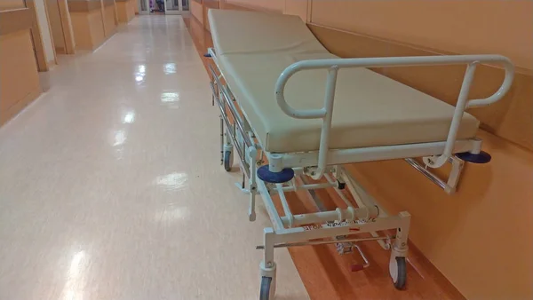 gurney or wheeled stretcher at hospital corridor. long corridor