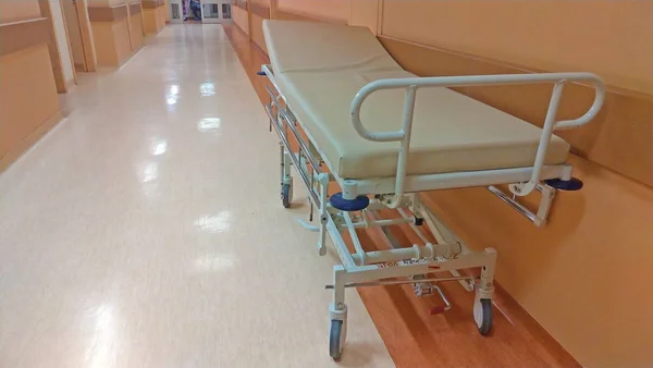 gurney or wheeled stretcher at hospital corridor. long corridor