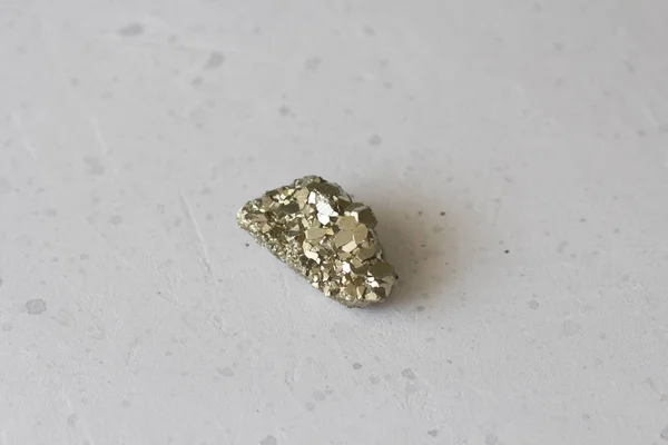 Beautiful iron from natural pyrite. On a white background. Golde — Stock Photo, Image