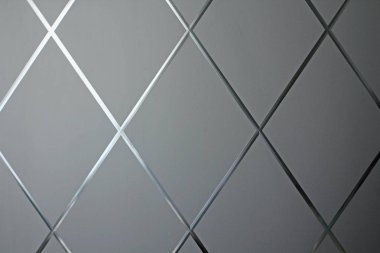 Eşkenar dörtgen arka plan. Eşkenar dörtgenin gri geometrik arka planı ve g
