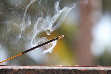 Incense stick and smoke from incense burning. Beautiful smoke. B clipart