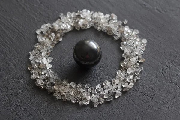 Scattered diamonds on a black background. Raw diamonds and minin