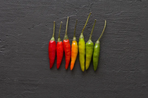 Red Hot Chili Peppers On Background or Black Table. A Lot of Red