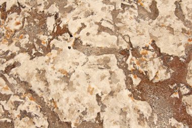 Kahverengi, bej ve gri taşların arka planı. Taş eski duvar