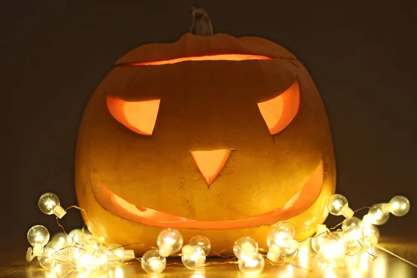 Halloween Pumpkins head. Orange pumpkin with a smile and glowing