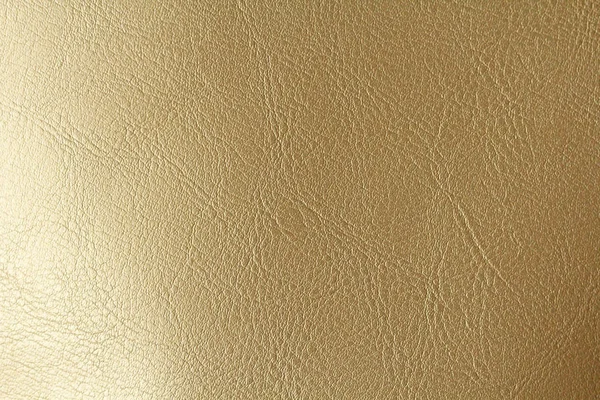 Złoto lub brąz naturalne skórzane tło. Błyszczący żółty liść gol — Zdjęcie stockowe