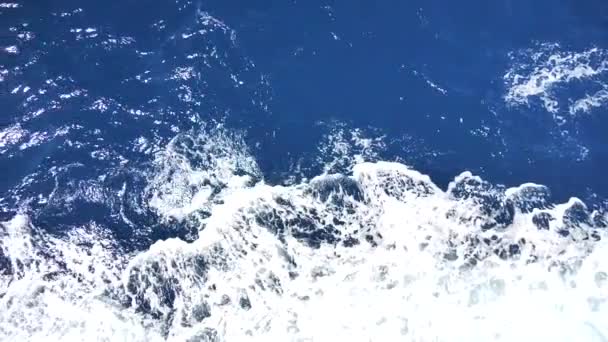 Sea water with foamy surface. Boat travel, sea foam, foam on blue, sea background waves. Rough deep turquoise and blue Mediterranean sea with white foam. Water spray from boat wake. Slow motion video. — Stock Footage Sea Water Foamy Surface Boat Travel Sea Foam Foam Blue Stock Video
