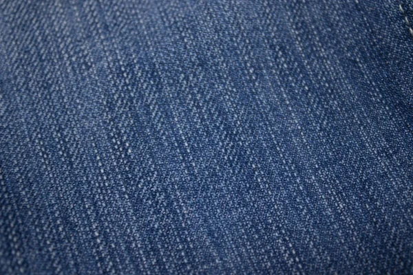 Tissu jeans-denim - fond texturé. convient pour le papier design, le texte de fond, les bannières, les panneaux d'affichage, les brochures — Photo