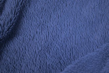 Mavi kumaş, dokulu arka plan. Tasarım kağıdı, arkaplan metni, resimler, afişler, reklam panoları, broşürler için uygun