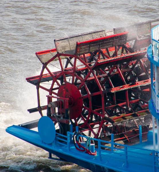 Red paddle from a paddle steamer boat in movement