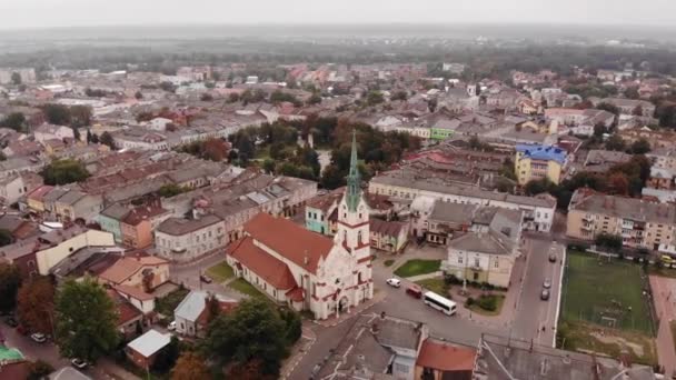 Aerial view of Stryi city architecture with fly around old Church of Our Lady Protectress, Ukraine, 4k — Stock Video