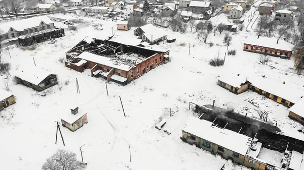 Aerial view of fire destroyed factory, winter time. Salt making factory in Drohobych, Ukraine. Drone photography.