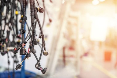 Bunch of wiring harnesses. Automobile industry background with copy space, light effect.