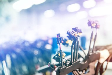 Bunch of wiring harnesses. Automobile industry background with copy space, light effect.