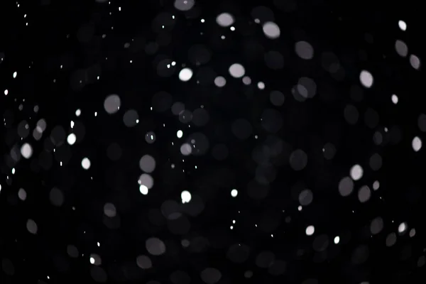 Real snowfall. Design pattern to overlay the image and create a snowfall effect. Deep black color — Stock Photo, Image
