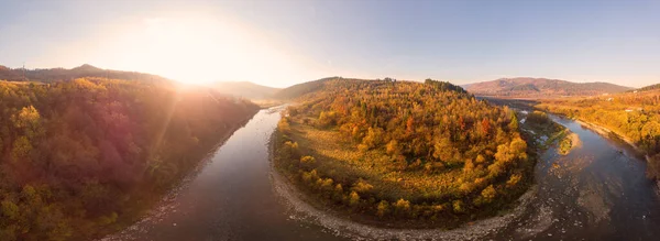 180 degrees panoramic landscape colorful autumn in Carpathians, Eastern Beskids. Aerial drone view of scenic natural landscape, mountains and forests, mountain river, slopes and valleys