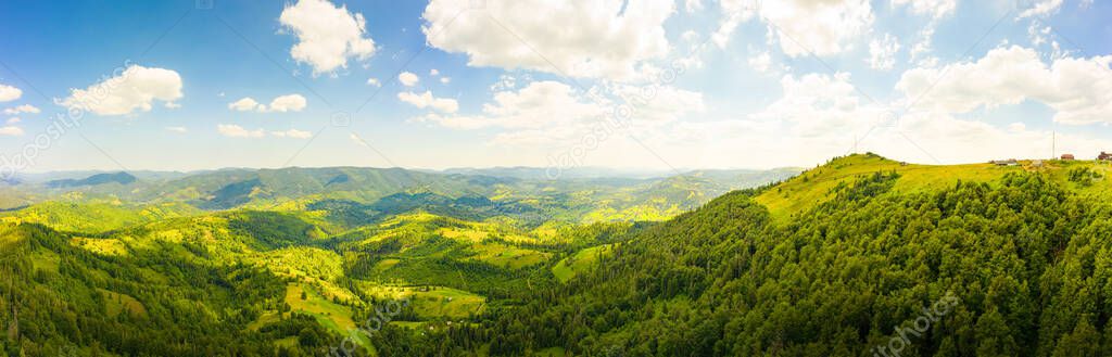 180 degrees scenic panoramic landscape of nature in Carpathians, Ukraine. Beautiful mountains and forests on slopes.