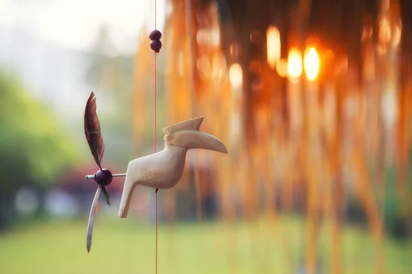 Summer toy bird decoration hand made in the sunset